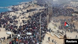 Palestinians, who were displaced to the south at Israel's order during the war, make their way back to their homes in northern Gaza, amid a ceasefire between Israel and Hamas, in the central Gaza Strip, Jan. 27, 2025.