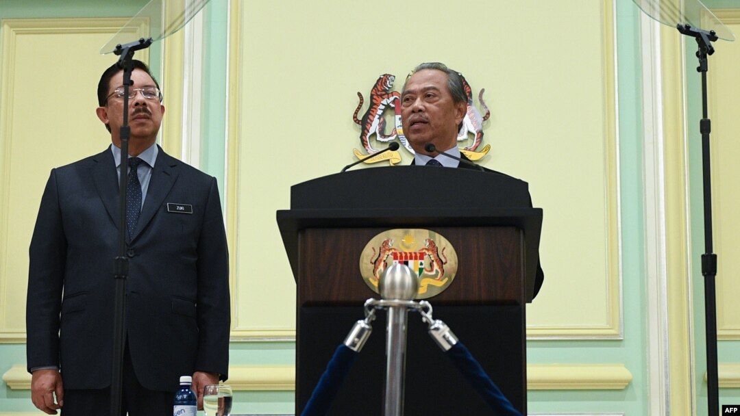 PM Malaysia Muhyiddin Yassin, mengumumkan susunan anggota kabinet barunya di kantor Perdana Menteri Malaysia di Putrajaya, Malaysia, 9 Maret 2020. (Photo by Mohd RASFAN / AFP)