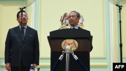 PM Malaysia Muhyiddin Yassin, mengumumkan susunan anggota kabinet barunya di kantor Perdana Menteri Malaysia di Putrajaya, Malaysia, 9 Maret 2020. (Photo by Mohd RASFAN / AFP)