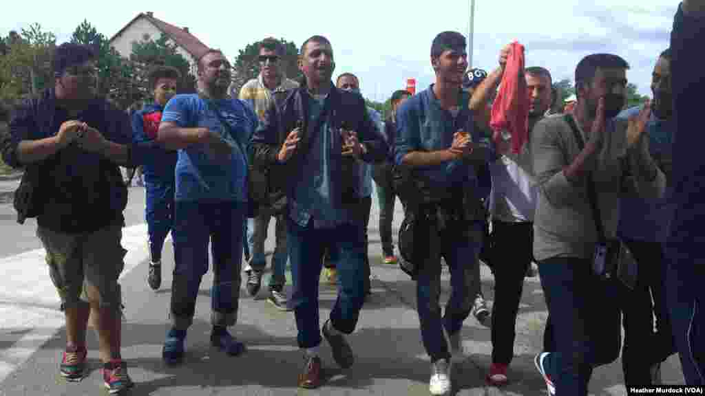 While refugees wait, protests erupt regularly, with refugees alternately demanding the borders open and then chanting simply, “please," at Harmica, Croatia, Sept. 20, 2015.