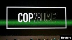 FILE -- Cop28 UAE' logo is displayed on the screen during the opening ceremony of Abu Dhabi Sustainability Week (ADSW) under the theme of 'United on Climate Action Toward COP28', in Abu Dhabi, UAE, January 16, 2023