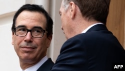 US Trade Representative Robert Lighthizer (R) and US Treasury Secretary Steven Mnuchin (L) await the arrival of Chinese Vice Premier Liu He at the Office of the US Trade Representative for trade negotiations in Washington, DC, May 10, 2019.