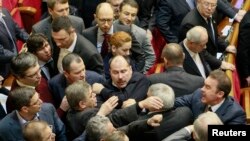 Ukrainian deputies clash in the parliament in Kyiv, Jan. 16, 2014. 