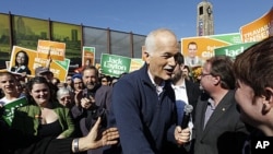 New Democratic Party (NDP) leader Jack Layton greets supporters during a campaign stop in the Montreal, May 1, 2011