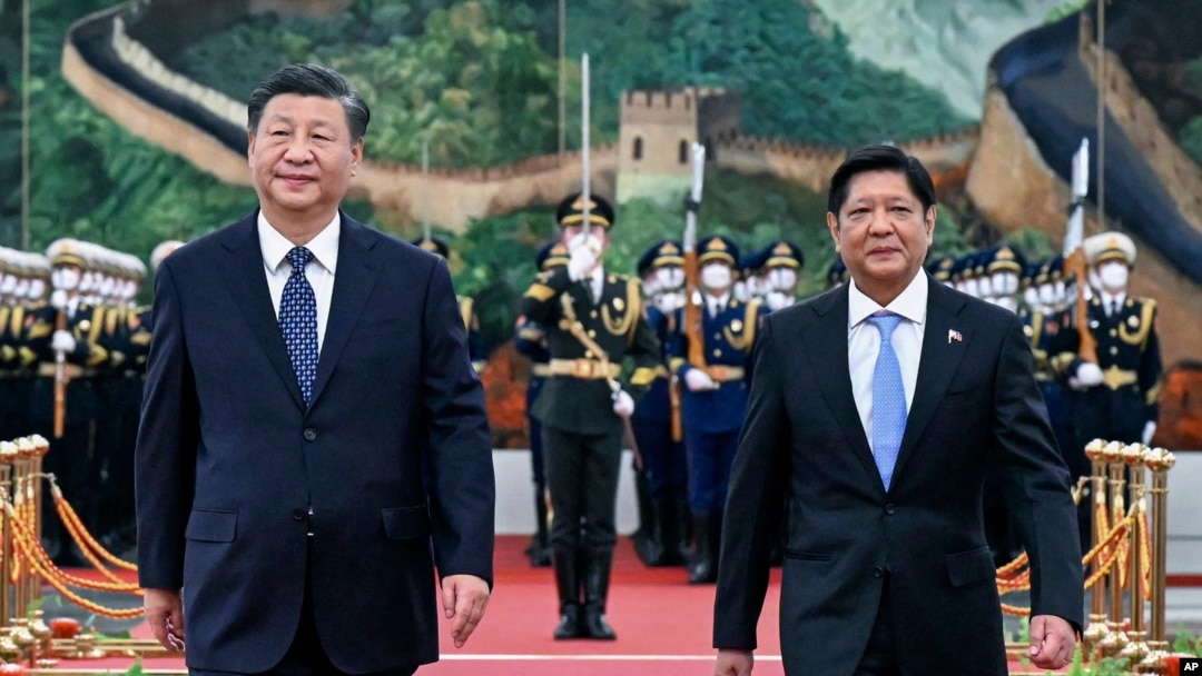 FILE - In this photo released by Xinhua News Agency, Chinese President Xi Jinping and visiting Philippine President Ferdinand Marcos Jr. appear together during a welcoming ceremony at the Great Hall of the People in Beijing, Jan. 4, 2023. 