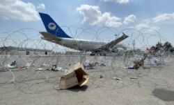 FILE - A commercial airplane is seen at the Hamid Karzai International Airport a day after U.S troops withdrawal in Kabul, Afghanistan, August 31, 2021.