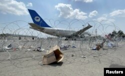A commercial airplane is seen at the Hamid Karzai International Airport a day after U.S troops withdrawal in Kabul, Afghanistan, August 31, 2021.
