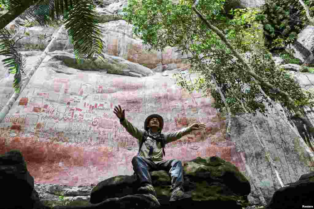 Amancio Caicedo, an indigenous tour guide, talks about the meaning of the cave paintings at the rocks of Cerro Pinturas, a large area protected for its archaeological importance, in San Jose de Guaviare, Colombia.