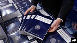 FILE - Copies of President Donald Trump's federal budget are seen on Capitol Hill in Washington, May 23, 2017.