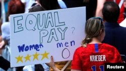 A fan displays a sign during the Women's World Cup Champions Parade in New York, July 10, 2019.