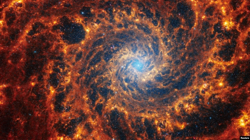 Spiral galaxy NGC 628, located 32 million light-years away from Earth, is seen in an undated image from the James Webb Space Telescope. (NASA, ESA, CSA, STScI, Janice Lee (STScI), Thomas Williams (Oxford), and the PHANGS team/Handout via REUTERS)