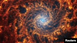 Spiral galaxy NGC 628, located 32 million light-years away from Earth, is seen in an undated image from the James Webb Space Telescope. (NASA, ESA, CSA, STScI, Janice Lee (STScI), Thomas Williams (Oxford), and the PHANGS team/Handout via REUTERS)