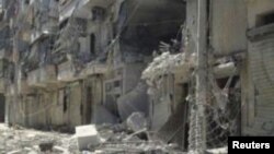 ເຮືອນຊານບ້ານຊ່ອງທີ່ຖືກທໍາລາຍ ໃນຄຸ້ມ Salahedinne ຢູ່ໃນຕົວເມືອງໃຫຍ່ Aleppo ຂອງຊີເຣຍF ວັນທີ 3 ສິງຫາ 2012. 