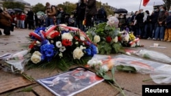 Floral tributes to Samuel Paty, the French teacher who was beheaded on the streets of the Paris suburb of Conflans St Honorine, are seen at the Place de la Republique, in Lille, France, Oct. 18, 2020. (Reuters)