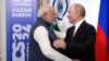 Russian President Vladimir Putin, right, embraces Indian Prime Minister Narendra Modi during their meeting on the sidelines of BRICS Summit at Kazan Kremlin in Kazan, Russia, Oct. 22, 2024. 