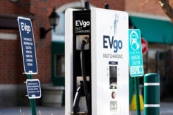 A EVgo electric vehicle charging station is seen at a shopping plaza in Northbrook, Ill., March 31, 2021. President Joe Biden's infrastructure plan calls for building a national network of 500,000 electric vehicle chargers by 2030.