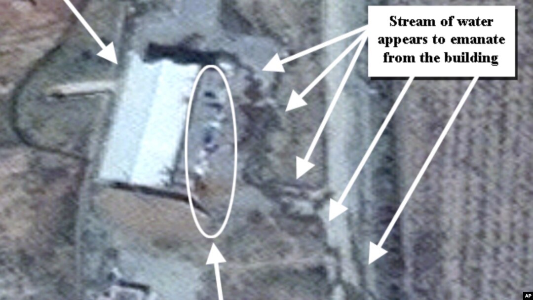This April 9, 2012 photo provided by the Institute for Science and International Security, ISIS shows suspected cleanup activities at a building alleged to contain a high explosive chamber used for nuclear weapon related tests in the Parchin military comp