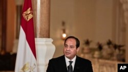 FILE - Egyptian President Abdel-Fattah el-Sissi meets with German Chancellor Angela Merkel, during a press conference, at the presidential palace in Cairo, Egypt, March 2, 2017. 