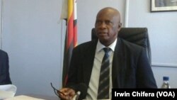 Ministers Joseph Made (L) and Patrick Chinamasa (R)