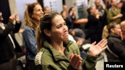 FILE —Members of Kfar Aza react, as people from their kibbutz community are released from the Gaza Strip, at a resort for the displaced community at Shefayim, Israel, November 26, 2023.