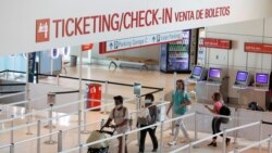 Passengers approach gate security for flights out of Love Field in Dallas, Wednesday, June 24, 2020. New York, Connecticut and New Jersey asked Wednesday for travelers from states with high coronavirus infection rates to go into quarantine for 14…