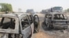 FILE - Burmt cars are seen after a deadly attack by suspected members of the Islamic State West Africa Province (ISWAP) in Auno, Nigeria, Feb. 9, 2020. 