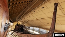 FILE - King Khufu's solar boat is displayed at a museum on the northern side of Khufu's Great Pyramid, in Giza, Egypt, Aug. 31, 2016. 