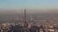 A small-particle haze hangs above the skyline, with the Eiffel Tower and the La Defense business district that is seen in the distance, in Paris, France, Dec. 1, 2016. 