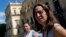 Deputy Director of Brazil's National Museum Cristiana Serejo talks with the media outside the museum that suffered a fire in Rio de Janeiro, Sept. 5, 2018. 