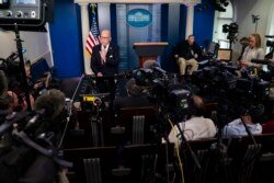 White House chief economic adviser Larry Kudlow talks with reporters about the impact of the Coronavirus on markets in the Brady Press Briefing Room of the White House, Friday, Feb. 28, 2020, in Washington. (AP Photo/Evan Vucci)