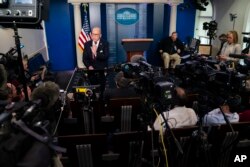 White House chief economic adviser Larry Kudlow talks with reporters about the impact of the Coronavirus on markets in the Brady Press Briefing Room of the White House, Friday, Feb. 28, 2020, in Washington. (AP Photo/Evan Vucci)