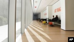 Visitors to the Museum of Modern Art in New York sit in the Louise Reinhardt Smith Gallery, June 2, 2017.