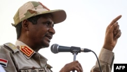 Mohamed Hamdan Dagalo, deputy head of Sudan's ruling Transitional Military Council (TMC) and commander of the Rapid Support Forces (RSF) paramilitaries, gives a speech in the village of Qarri, about 90 kilometres north of Khartoum, June 15, 2019. 