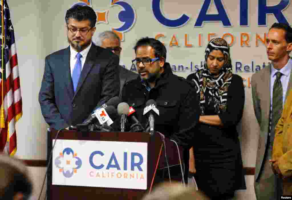 Farhan Khan (C), brother-in-law of San Bernardino shooting suspect Syed Farook, speaks at the Council on American-Islamic Relations during a news conference in Anaheim, California, Dec. 2, 2015.