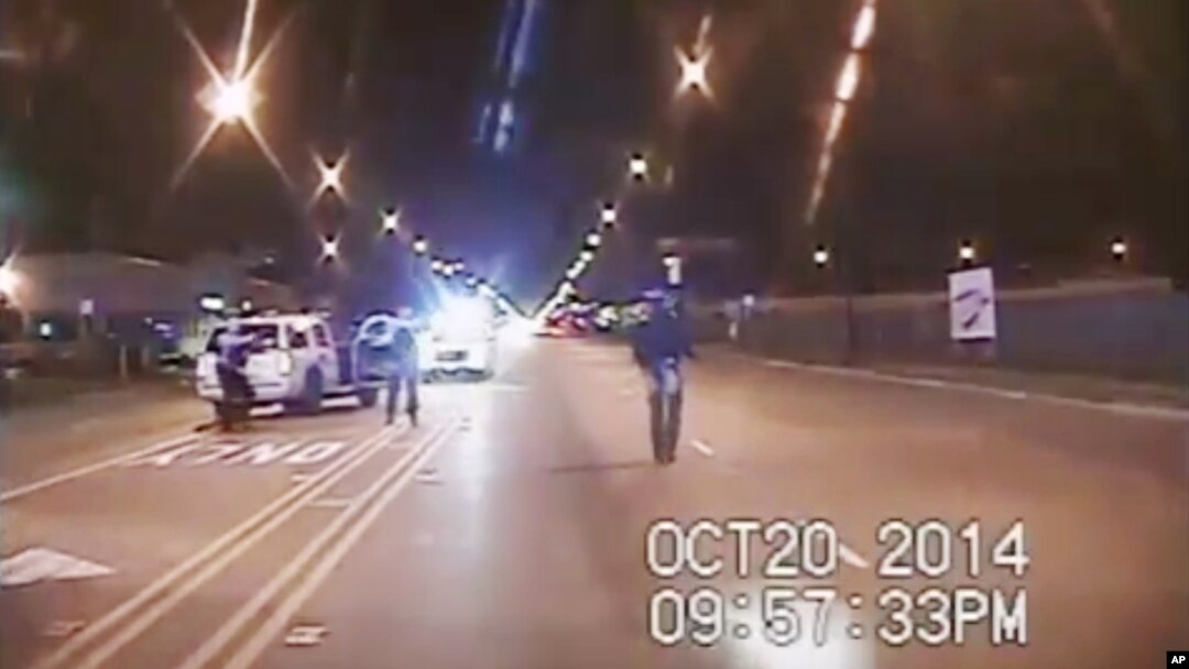 In this Oct. 20, 2014 frame from dash-cam video provided by the Chicago Police Department, Laquan McDonald walks down the street moments before being shot by police officer Jason Van Dyke. 