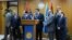 Fayez Seraj, flanked by members of the Presidential Council, speaks during a news conference at the Mitiga Naval Base in Tripoli, Libya, March, 30, 2015.
