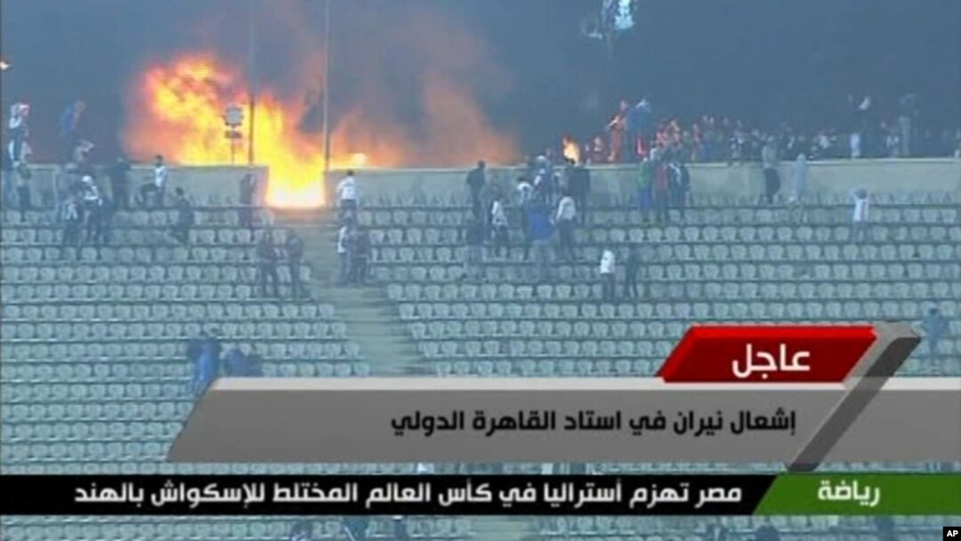 FILE - This image from Egypt TV shows fans and a fire at a soccer stadium in Port Said, Egypt, February 1, 2012. (AP)