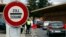 A sign is pictured at the Swiss French border with town of Ferney Voltaire in Le Grand-Saconnex near Geneva, Feb. 10, 2014. Swiss voters on Sunday narrowly backed proposals to reintroduce immigration quotas with the European Union. 