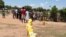 South Sudanese wait to fill a long line of jerry cans at a borehole in the Ocea sector of Rhino refugee resettlement camp in Uganda. 