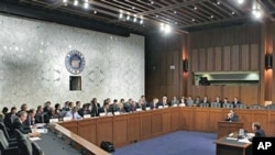 Members of the Joint Select Committee on Deficit Reduction hold a public hearing with Congressional Budget Office Director Douglas Elmendorf, seated at right, on Capitol Hill in Washington, October 26, 2011.