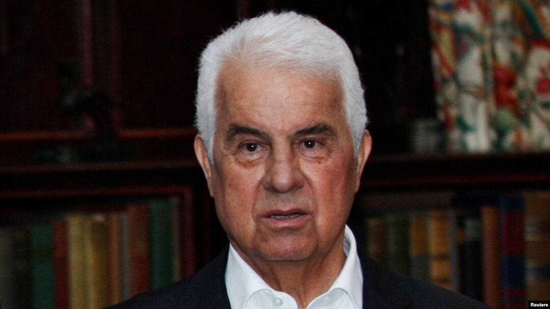FILE - Turkish Cypriot leader Dervis Eroglu attends a photo call during a meeting with the leaders of the Greek and Turkish Cyprus communities at the Greentree estate in Manhasset, New York.