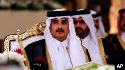 FILE - Qatar's Emir Sheikh Tamim bin Hamad al-Thani attends a Gulf Cooperation Council summit in Doha, Qatar, Dec. 9, 2014.