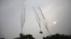 Balloons containing leaflets denouncing Pyongyang are seen after former North Korean defectors released them towards North Korea at a field near the demilitarized zone separating the two Koreas in Gimpo, west of Seoul June 24, 2012. 