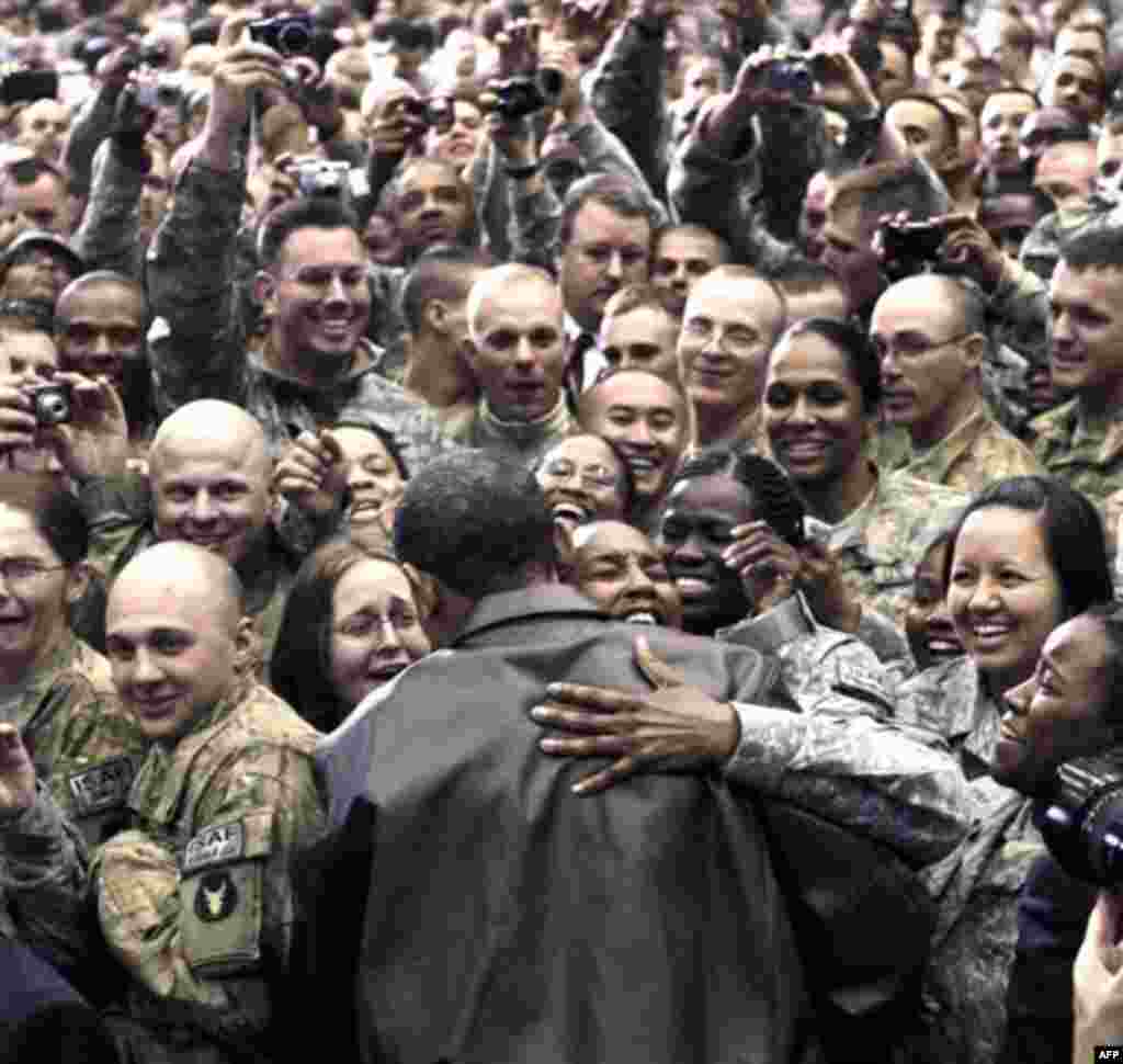 President Barack Obama greets troops at a rally during an unannounced visit at Bagram Air Field in Afghanistan, Friday, Dec. 3, 2010. (AP Photo/Pablo Martinez Monsivais)