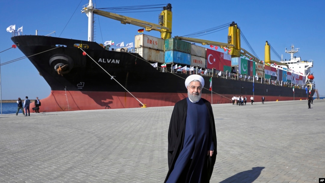 FILE - Iranian President Hassan Rouhani poses at a newly built extension of the port of Chabahar, near the Pakistan border.