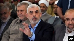 FILE - Yahya Sinwar, the leader of Hamas in Gaza, greets supporters at a meeting in Gaza City on April 30, 2022. The EU added Sinwar to its terrorist sanctions blacklist on Jan. 16, 2024.