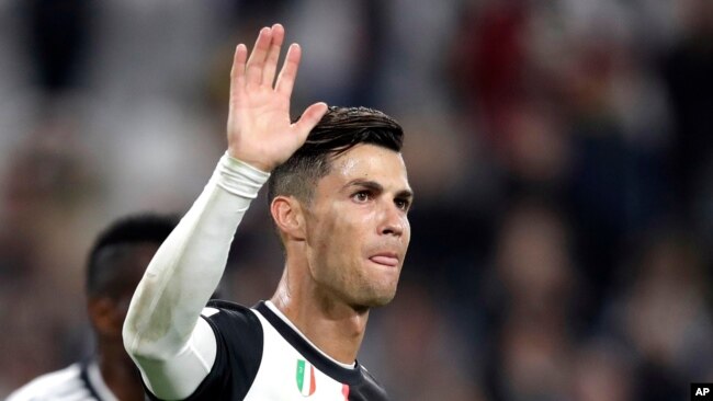 FILE - Cristiano Ronaldo, then a Juventus player, waves at the end of a soccer match between Juventus and Bologna, at the Allianz stadium in Turin, Italy, Oct. 19, 2019.