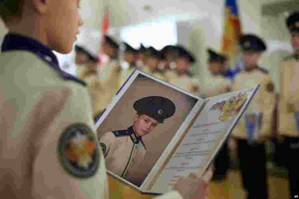 Students of the Moscow military music college take part in an initiation ceremony. Students of the college receive instruction in gender-segregated classes and are expected to master at least two musical instruments and basics of ballroom dancing. Military educational establishments like this have gained popularity in the past few years in Russia.