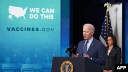 President Joe Biden, with Vice President Kamala Harris, speaks on COVID-19 response and vaccinations in the South Court Auditorium of the Eisenhower Executive Office Building, next to the White House, in Washington, June 2, 2021. 