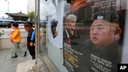 A South Korean news magazine with front cover photos of U.S. President Donald Trump and North Korean leader Kim Jong Un, right, and a headline "Korean Peninsula Crisis" is displayed at the Dong-A Ilbo building in Seoul, South Korea, Sept. 11, 2017. 